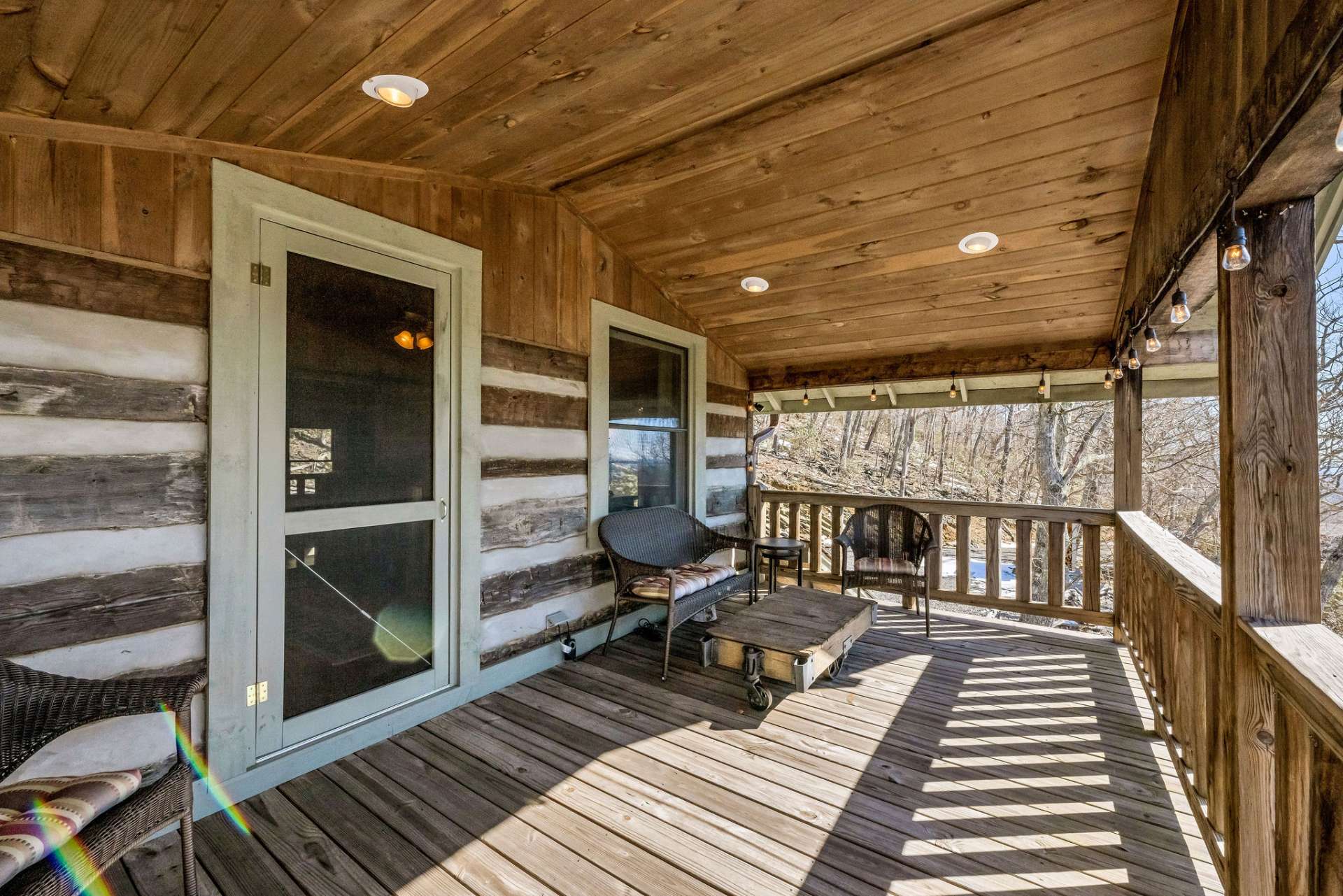 This covered porch offers year-round enjoyment with uninterrupted views in any weather.