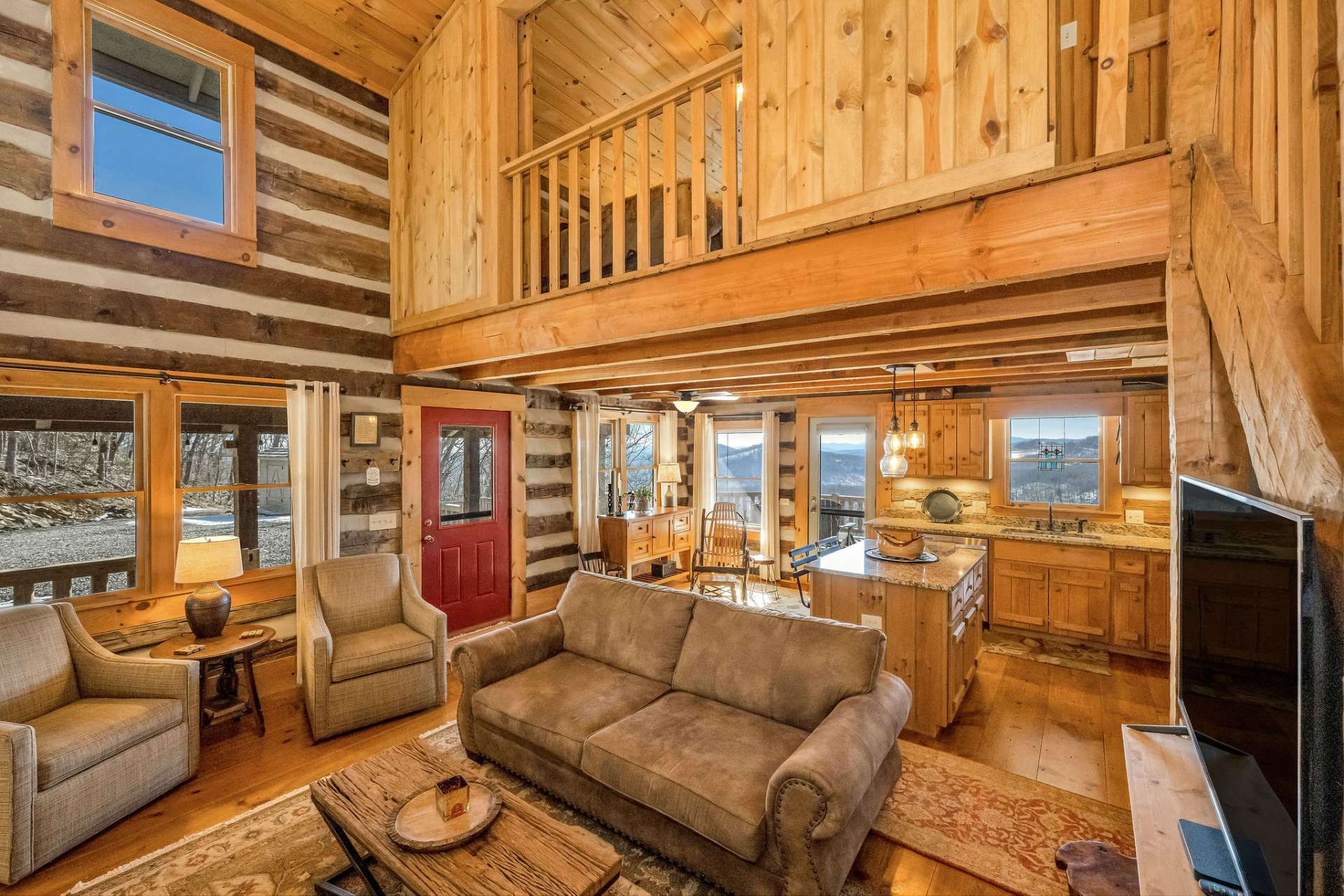 The custom-designed loft's sliding barn doors enhance the open concept of this space.