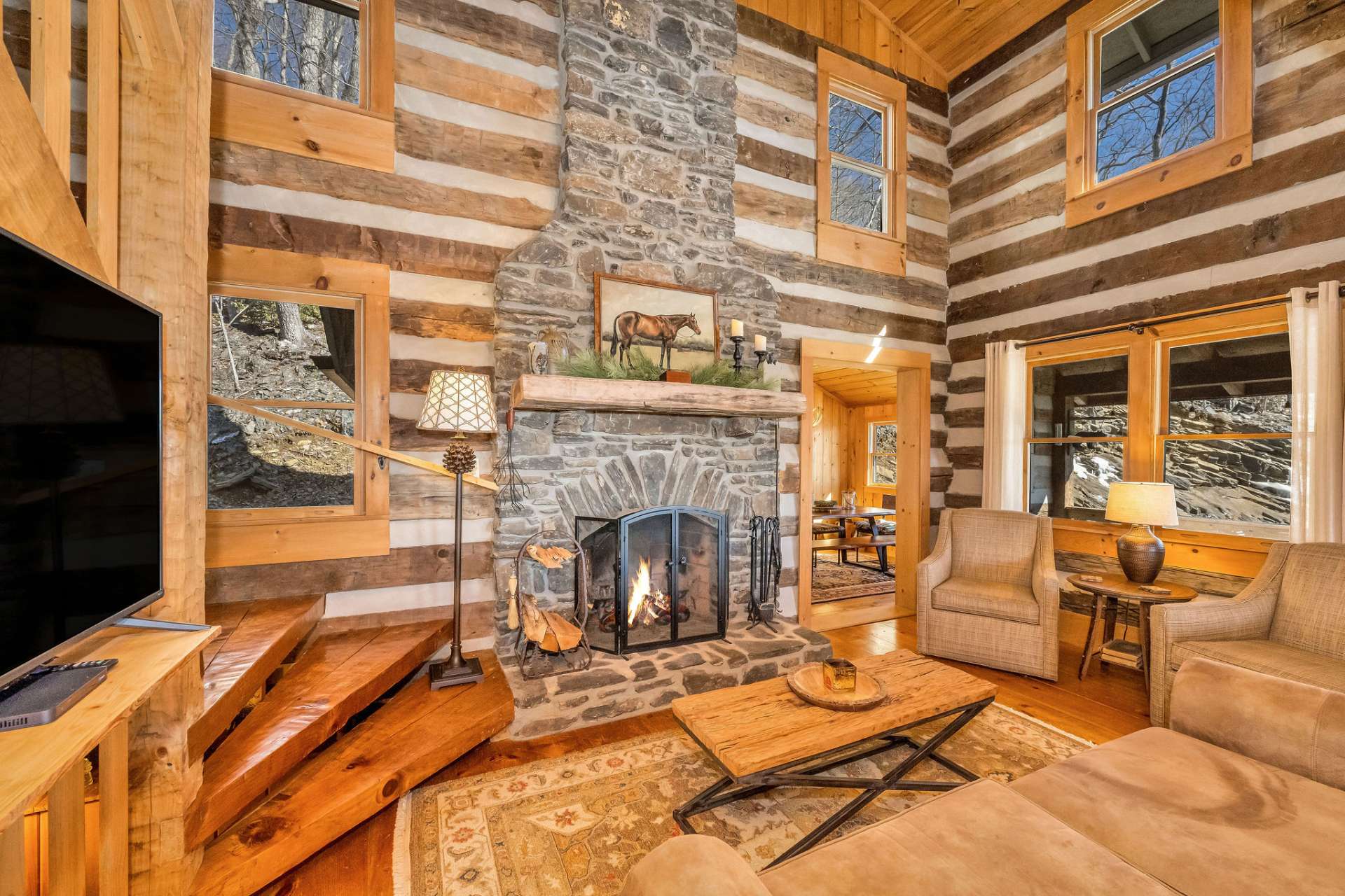 The focal point of the great room seamlessly blends the natural mountain elements with timeless warmth.