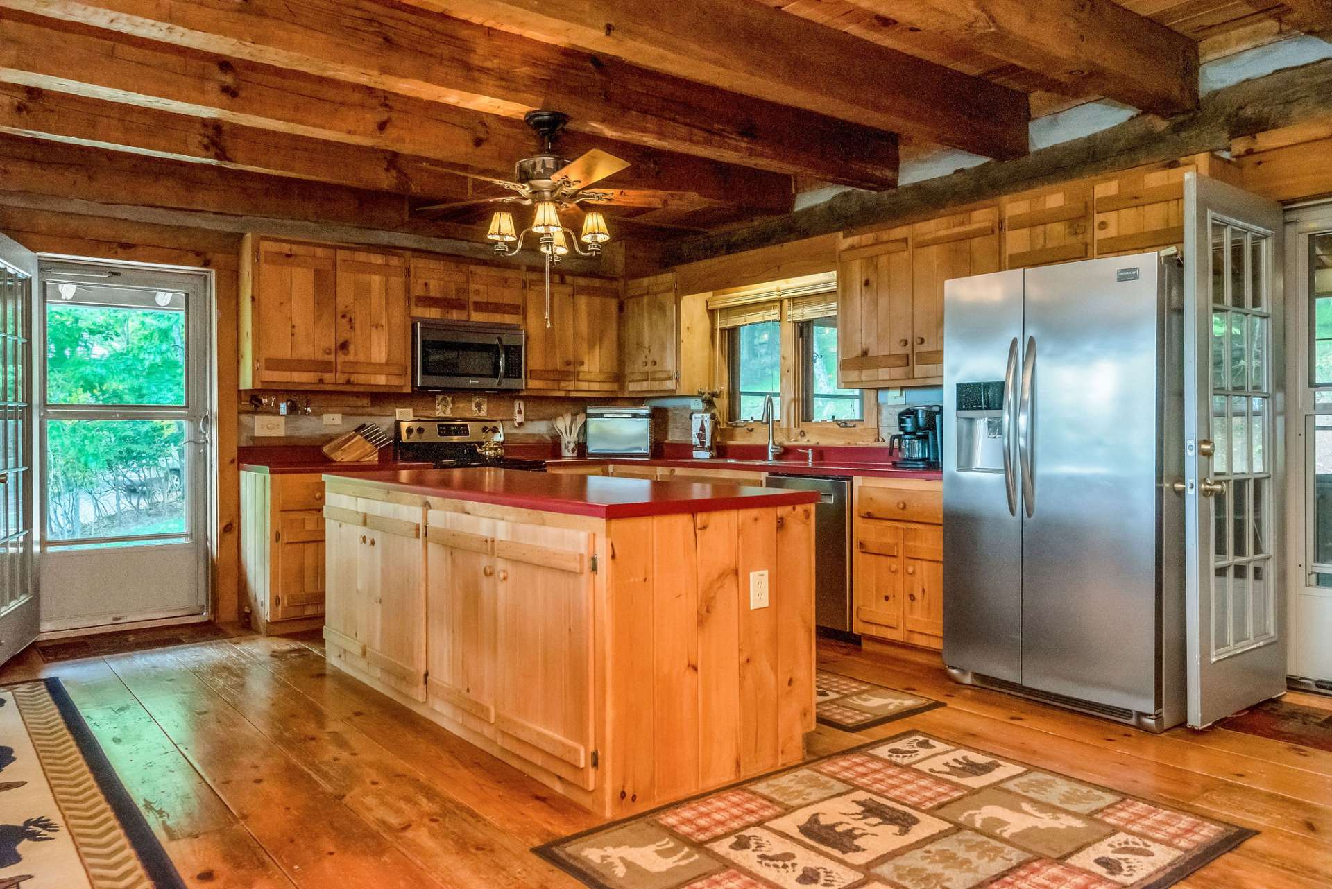 The kitchen boasts stainless appliances and a substantial island with additional storage.