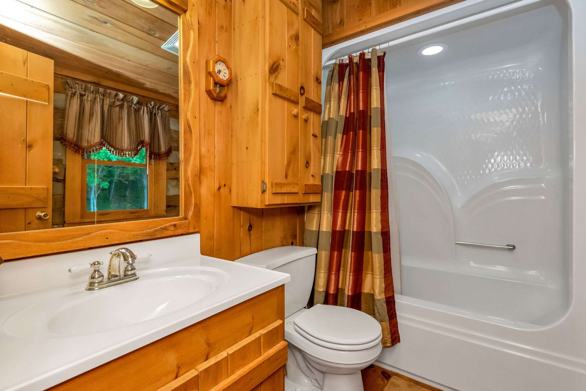 The upper-level full bath is complete with a tub/shower combo.