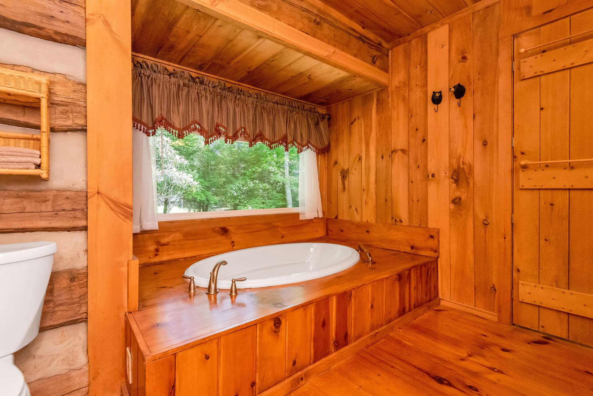 a soaking tub with a scenic backdrop.